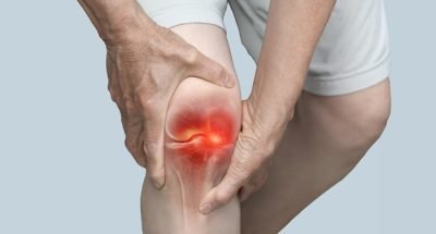 Hand,Holding,Knee,With,Pain,Due,To,Degenerative,Arthritis